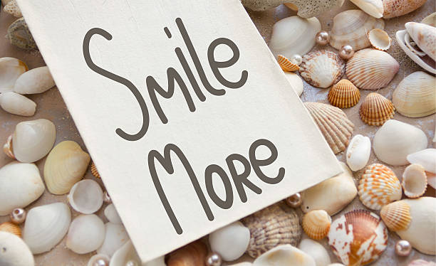 istock Smile more. Inspirational quote handwritten ink and brush 525883302