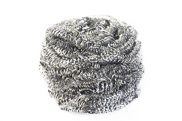 istock stainless steel scourer on white background 525884240
