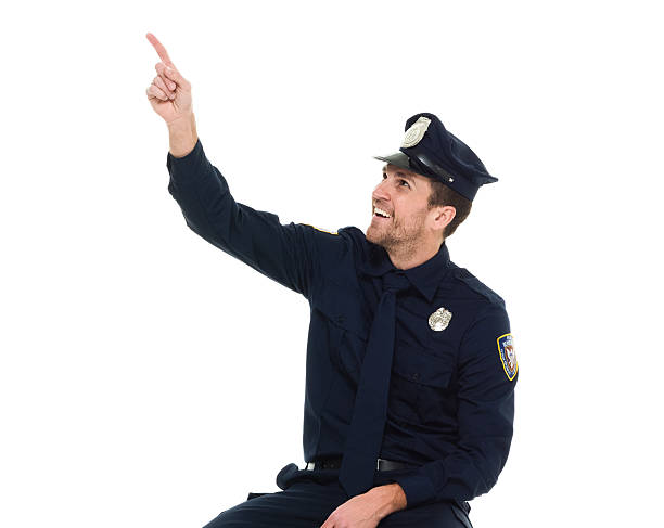 istock Cheerful police pointing away 525884842