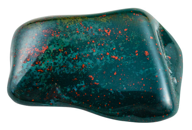 tumbled heliotrope (bloodstone) isolated on white macro shooting of natural mineral stone - tumbled heliotrope (bloodstone, green jasper or chalcedony with red inclusions of hematite) gemstone isolated on white background tumbled heliotrope bloodstone gemstone stock pictures, royalty-free photos & images