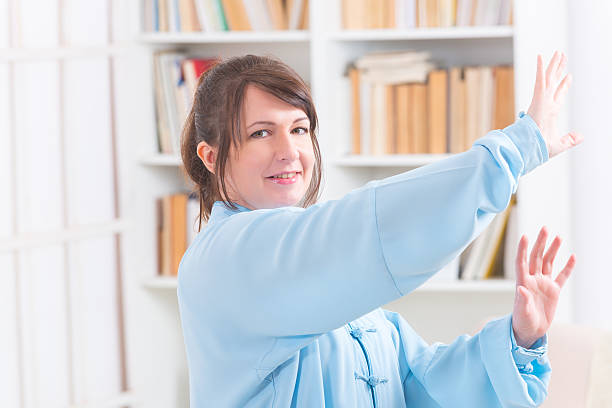 istock Woman doing qi gong tai chi exercise 525885602