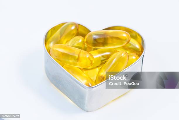Fish Oil Pills On Heart Isolated Stock Photo - Download Image Now - Abstract, Box - Container, Capsule - Medicine
