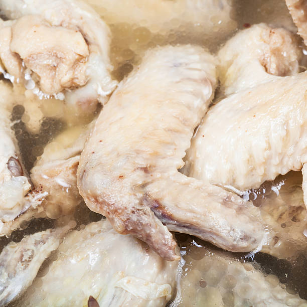 istock boiled chicken wings in meat broth close up 525888532