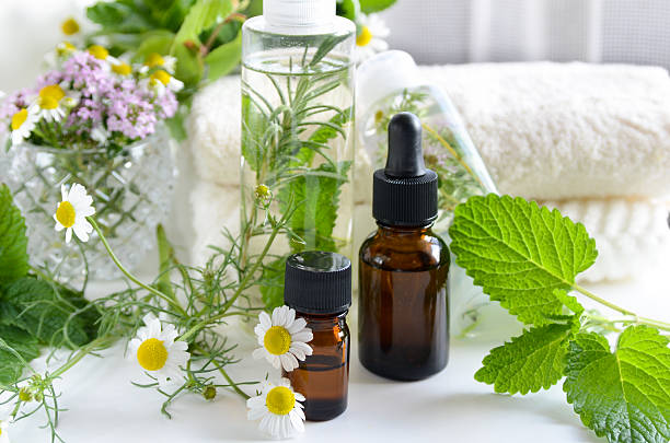 essential oils and natural cosmetics with herbs stock photo