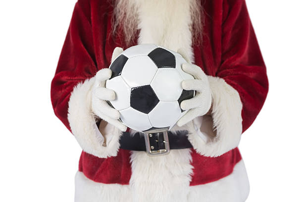 istock Santa holds a classic football 525894041