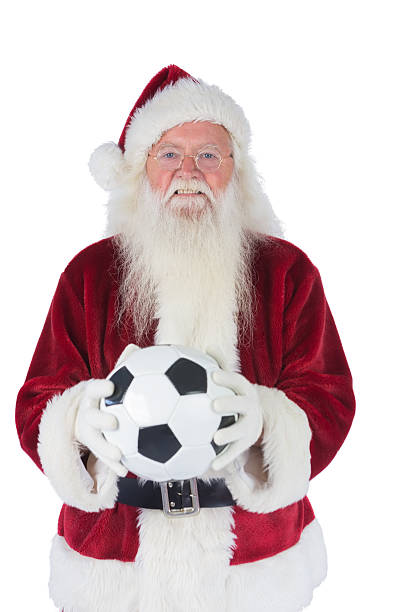 istock Santa holds a classic football 525894045