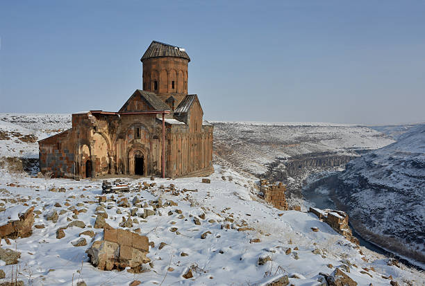 Ani - Saint Gregory church Ruins of famous  Saint Gregory (Tigran Honents) church is surrounded with winter landscape. Ani is a ruined medieval Armenian city-site situated in the Turkish province of Kars, near the border with Armenia. monastery religion spirituality river stock pictures, royalty-free photos & images