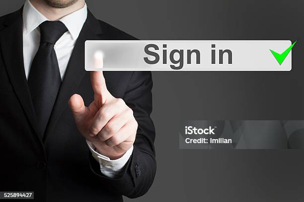 Businessman Pushing Button Sign In Stock Photo - Download Image Now - Log On, Log Out, Accessibility