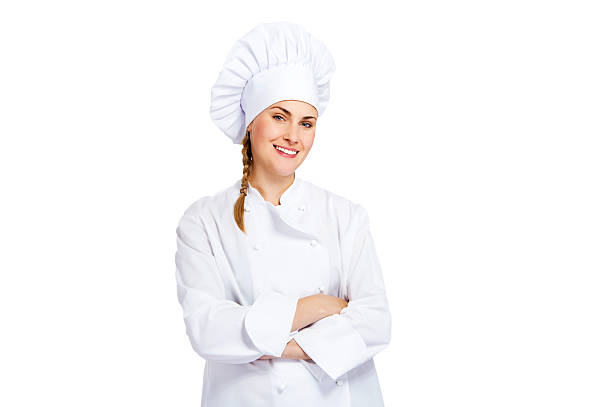 young, female chef in a traditional hat and coat. stock photo