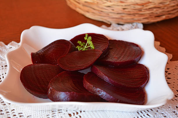 istock Sliced beetroot salad on the white plate 525895393