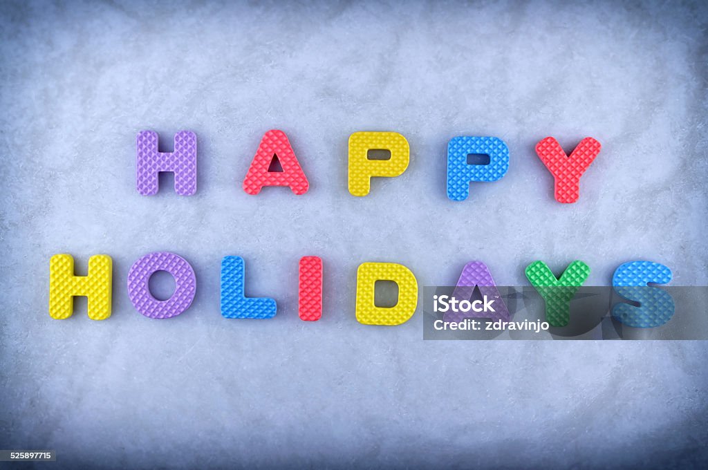 Happy Holidays Happy Holidays sign made out of alphabet isolated on icy background 2015 Stock Photo