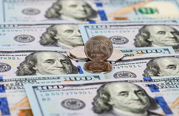 istock Russian rubles coins and dollars banknotes close up 525898465