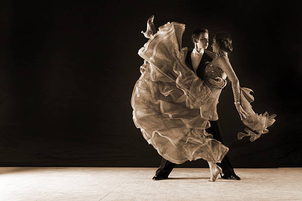 istock dancers in ballroom against on black 525898815
