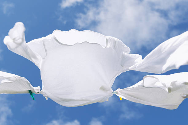 istock Drying laundry on washing line in a fresh summer breeze 525899525
