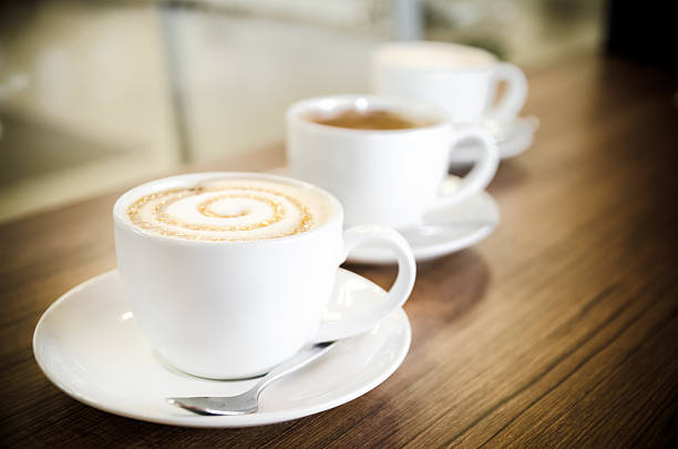 istock Three cups of coffe in diagonal line 525899789