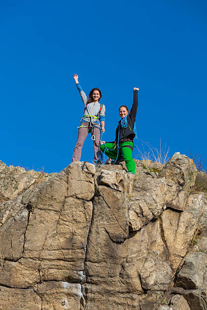 istock Female climbers on the top of mountain 525900623