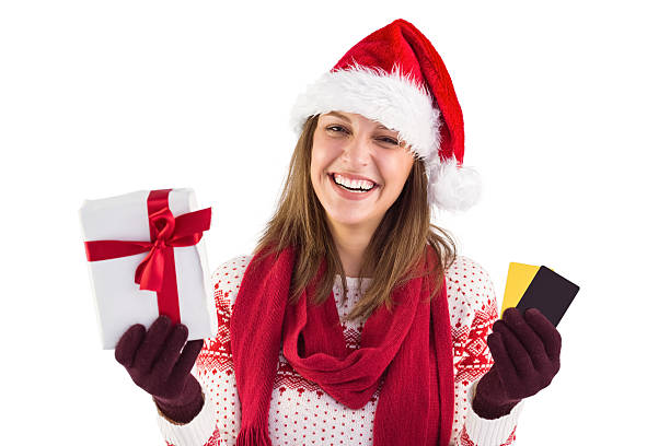 istock Smiling young brunette with gift and credit card 525900903