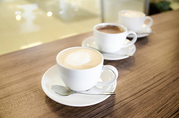 istock Three cups of coffe in diagonal line 525900919