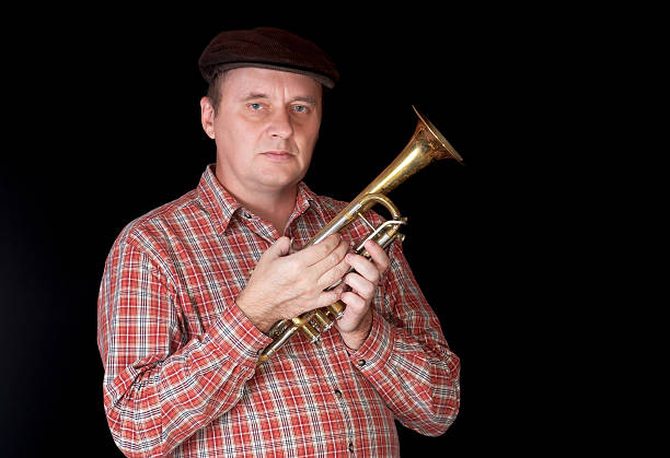 istock Portrait of mature trumpeter 525913923