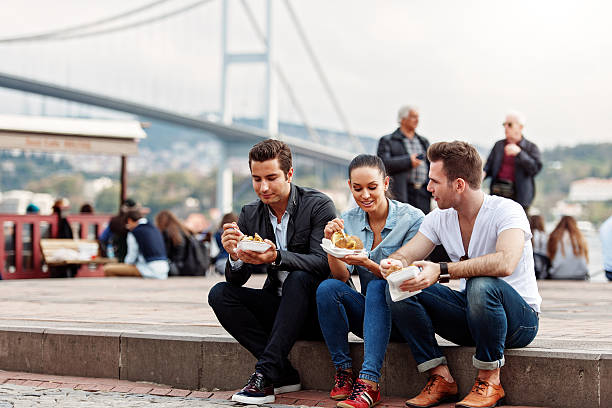 istock Tourists and friends having a snack in Ortakoy 525915673