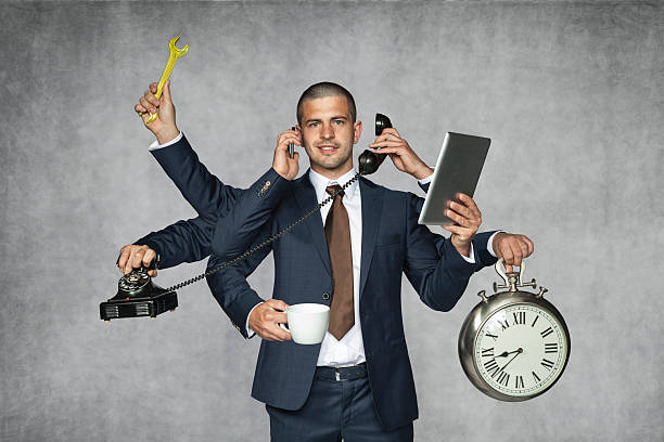 multipurpose businessman multipurpose businessman multi tasking stock pictures, royalty-free photos & images