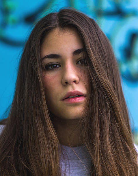 istock serious girl brunette grafitti bokeh 525937357