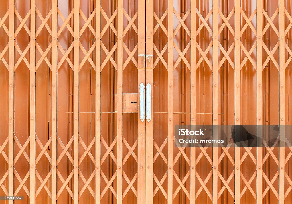 The old orange steel door The old rusty orange steel door Abstract Stock Photo