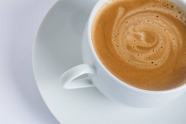 istock cup of coffee in a white cup on a white plate 525938517