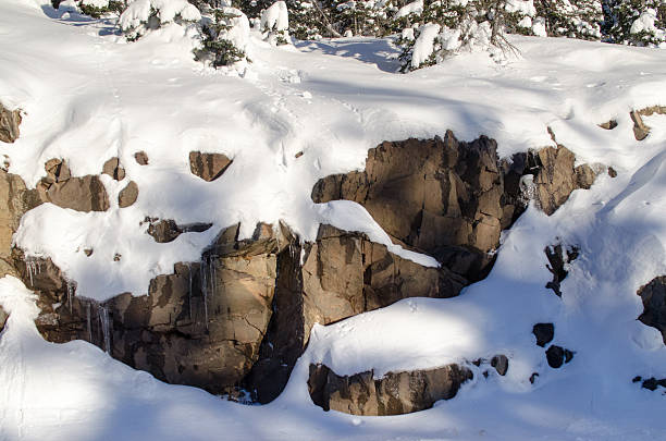 istock rocks covered with the snow, winter time, colorado 525939873