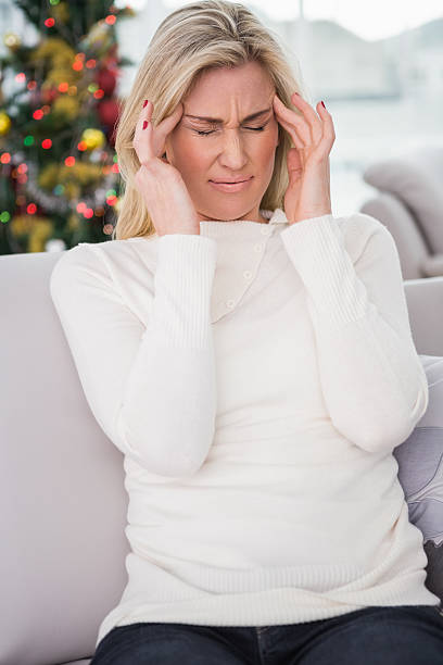 istock Blonde getting a headache on christmas day 525939917
