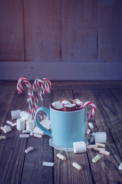 istock Mug filled with hot chocolate and marshmallow  and candy canes i 525939949