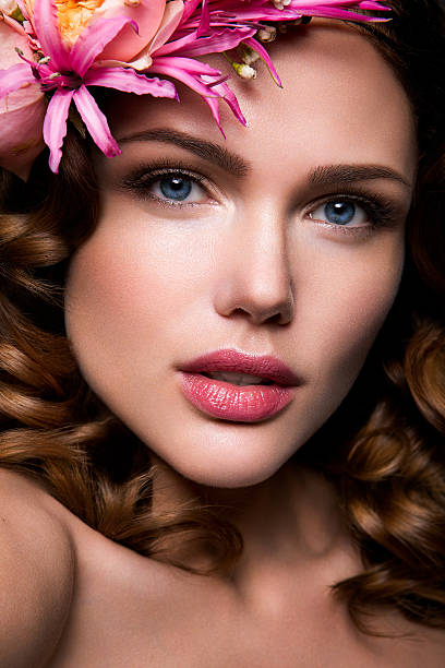 istock Beautiful lady with a wreath of flowers 525940803