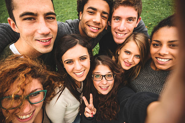 istock Group of college student laughing and doing a selfie 525940841