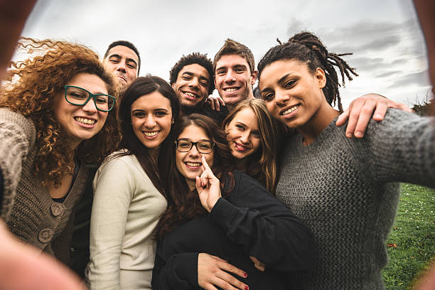 istock Group of college student laughing and doing a selfie 525940845