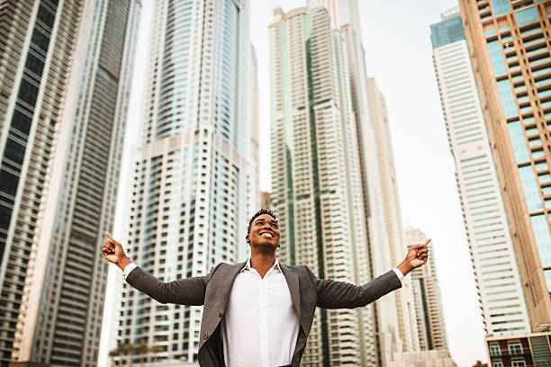 istock Successful business man against the skyscraper 525951441