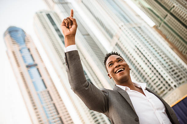 istock Successful business man against the skyscraper 525951443