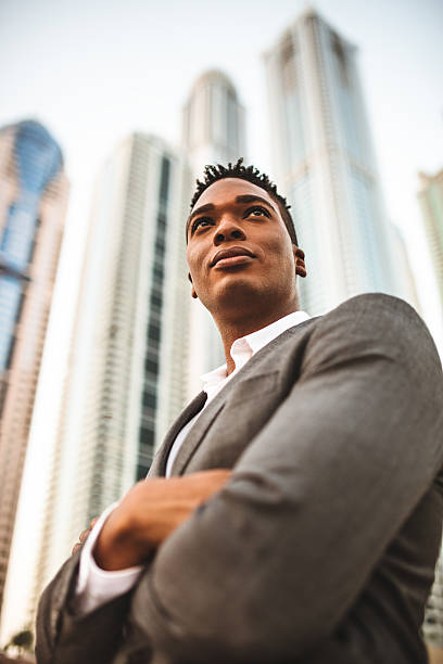 istock Successful business man portrait against the skyscraper 525951449