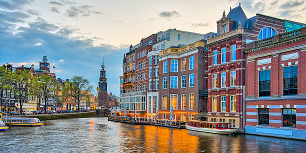 istock Amsterdam canals with bridge and typical dutch houses in Netherl 525955588