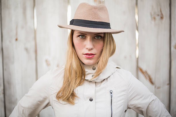 istock Cheerful blonde model posing with hand on hips 525956329