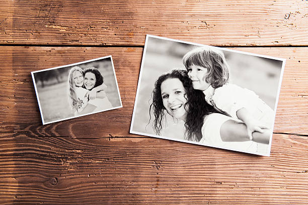 istock Mothers day composition. Black-and-white pictures, wooden backgr 525959018