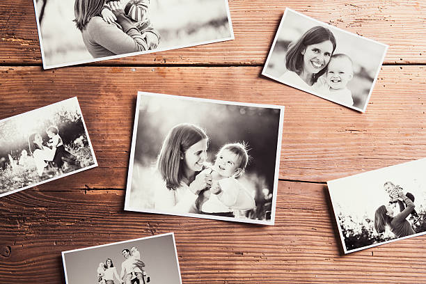 istock Mothers day composition. Black-and-white pictures, wooden backgr 525959168