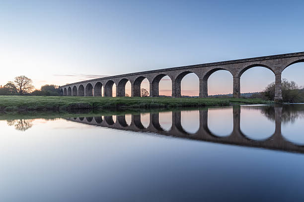 The Arthington Railway Viaduct, UK The mirror calm River Wharfe in West Yorkshire at dawn river wharfe stock pictures, royalty-free photos & images