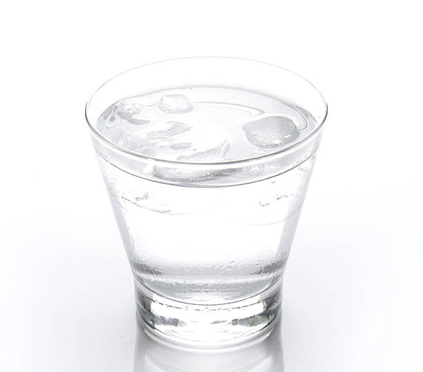 istock Glass of water with ice  on white background. 525959996