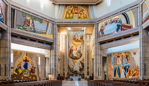 Interior of Pope John Paul II Sanctuary in Krakow, Poland Cracow, Poland - April 29, 2016: Interior of the main upper church in the Pope John Paul II Sanctuary in Krakow, Poland, decorated with mosaics pope john paul ii stock pictures, royalty-free photos & images