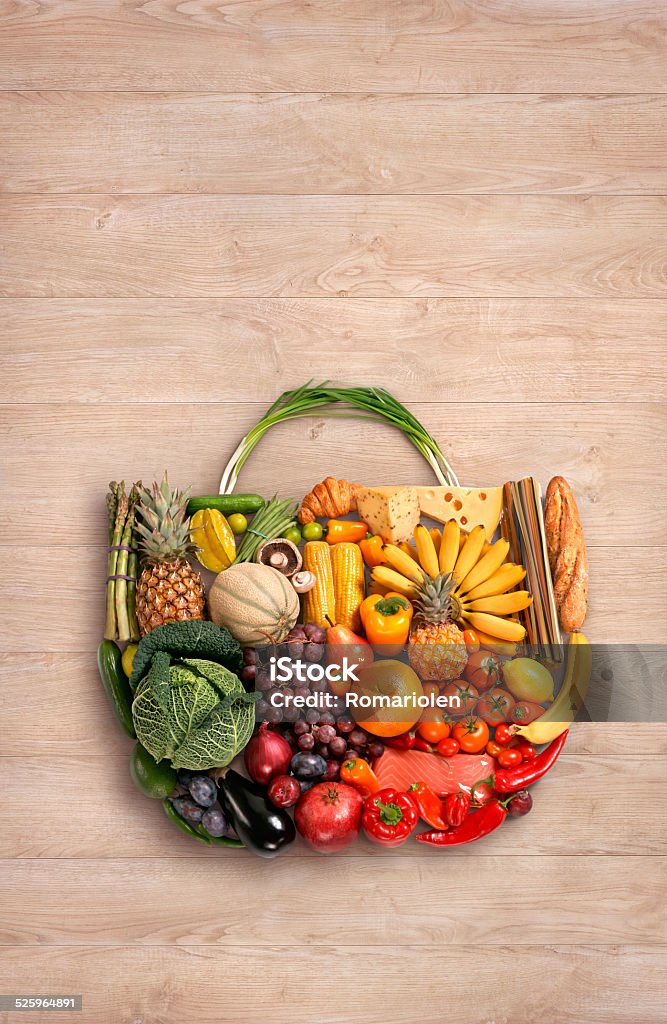 Foods made handbag food photo of designer handbag made from different fruits and vegetables on wooden table Asparagus Stock Photo