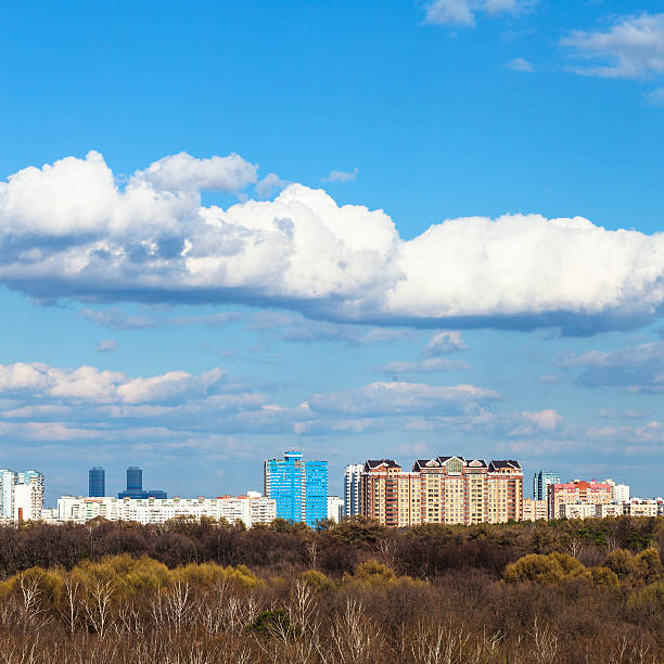 istock blue sky with white clouds over city in sunny day 525966888