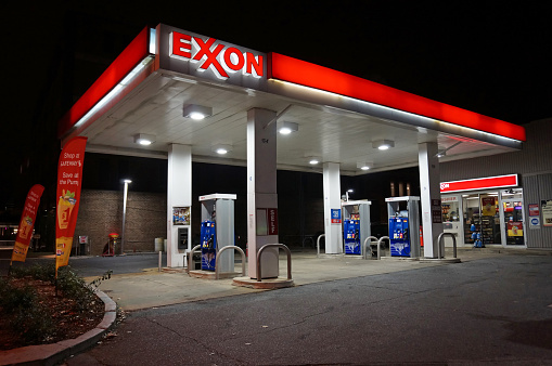 Washington DC, USA-November 29, 2014:  This Exxon gas station was spotted at night in Northwest Cleveland Park in Washington DC.  It is empty at this hour though gas prices have fallen making travel more affordable.