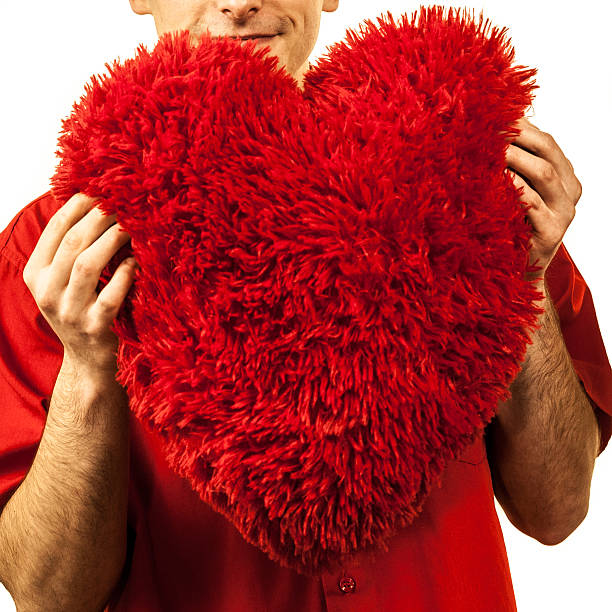istock Man holding red heart isolated 525967594
