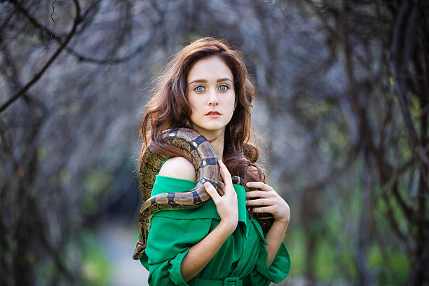 Attracrive girl with snake stock photo