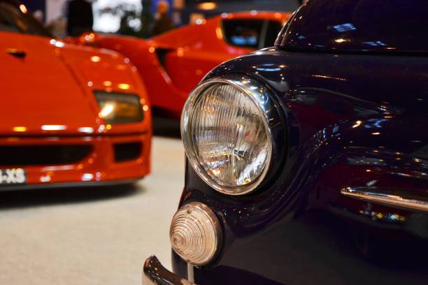 Paris, France, February 6th, 2014: The presentation of Fiat 500 and Ferrari F40 on the Retromobile Motor Show in Paris. These vehicles are one of the most wanted cars by collectors with Italian brands.